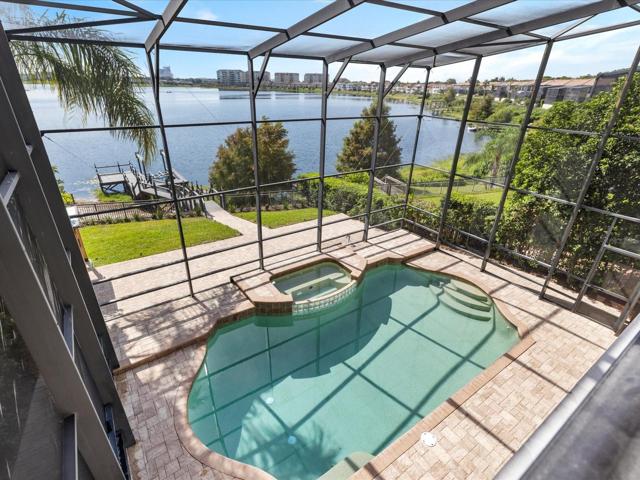 The backyard is nothing short of an entertainer's dream with multiple seating areas, starting with the covered LANAI overlooking the screened and heated POOL and SPA, ideal for relaxation or spending the day with family and friends!