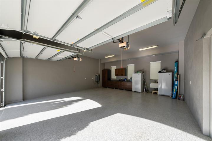 All 4 garage bays have epoxy flooring and added storage