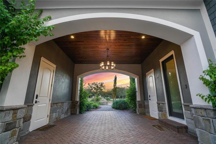 Porte-cochere leads to fire pit and gardens