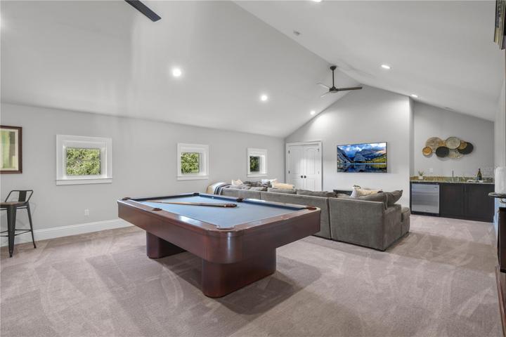 Features vaulted ceilings and wet bar