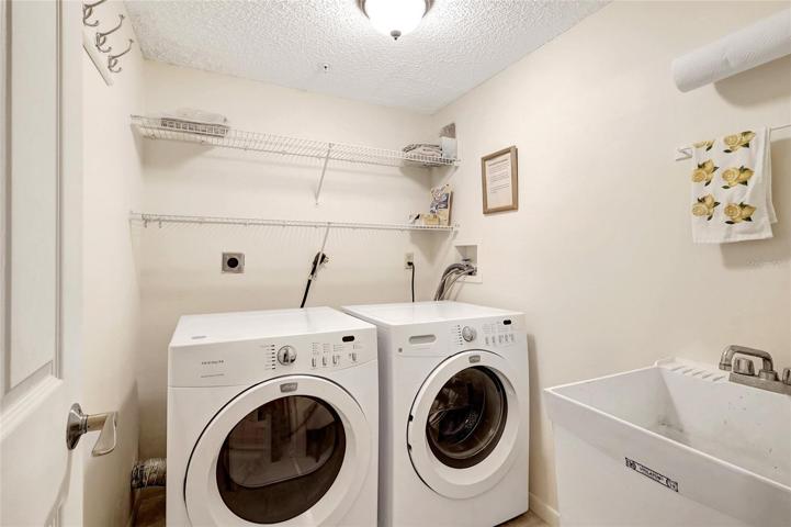The laundry room is a time-saving addition to the home, making chores a breeze. It's equipped with everything you need to keep your clothes clean and fresh, including a washer and dryer.