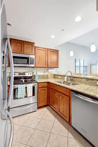 The dual sink allows for easy meal preparation and cleanup, while the granite countertops add a touch of sophistication.