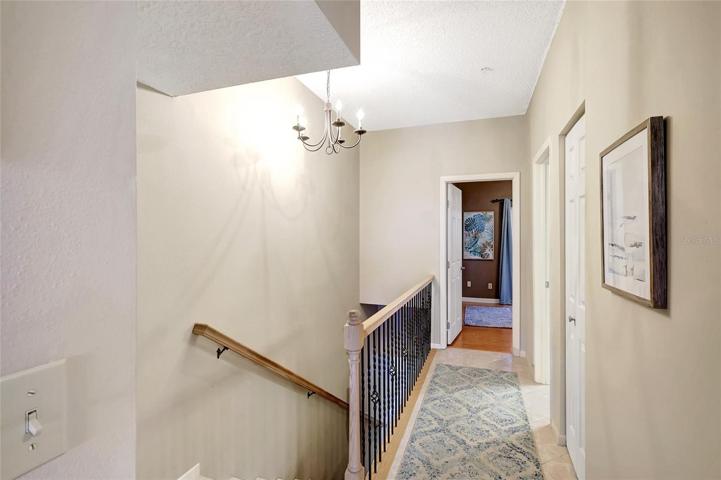The hallway leading to the one of the bedrooms in this lovely townhome.