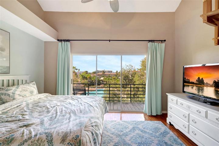 Step into the primary bedroom of this townhome, featuring oversized sliding doors that lead to your very own private retreat. These expansive doors flood the room with natural light, creating a bright and inviting atmosphere.