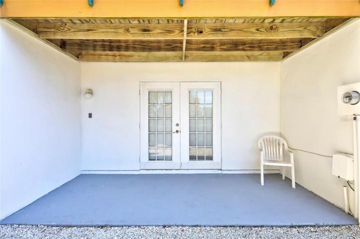 The cozy patio of this townhome, which offers a unique entrance to the garage area.