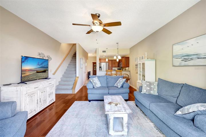 This open-concept design allows for easy interaction and entertaining. The dining area is spacious, ideal for family gatherings and meals, while the living room offers a comfortable spot to relax and unwind.