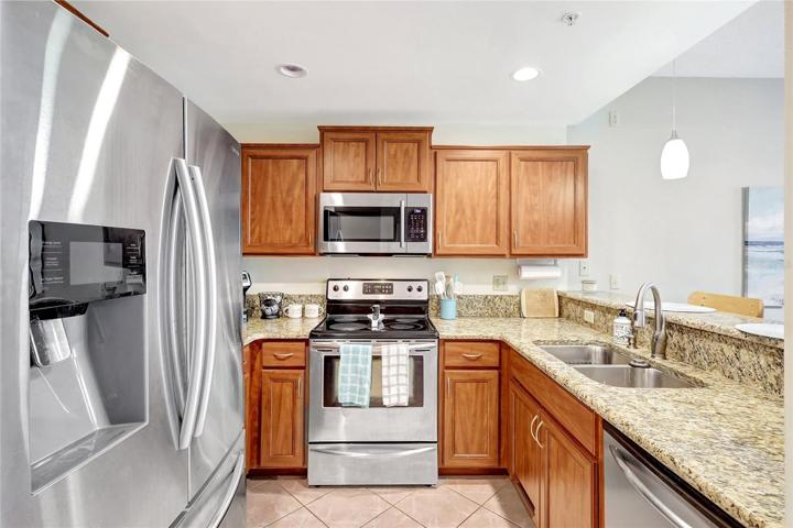 The kitchen's open layout ensures you're always part of the action, whether you're cooking or chatting with family and friends. With modern appliances and ample storage, meal preparation becomes a breeze.