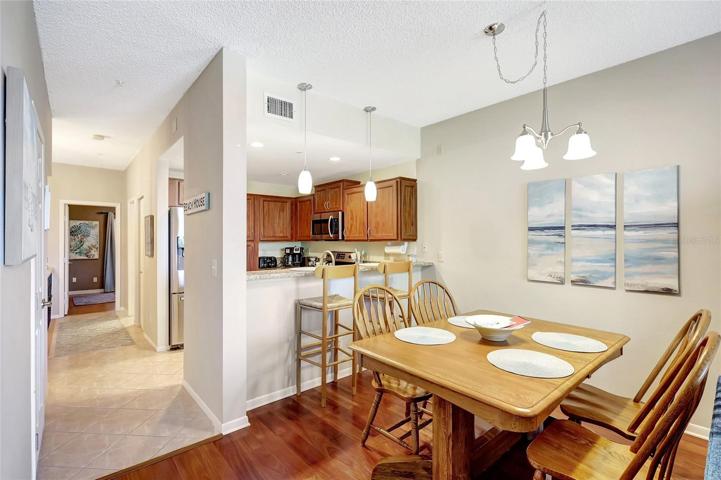 The welcoming dining room in this townhome is comfortable and inviting space for sharing meals and creating memories with loved ones.
