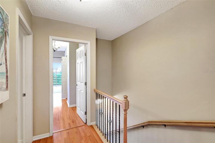 The hallway going to the main bedroom of this amazing townhome.