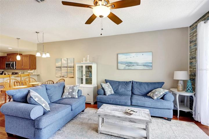 The living room is perfect for family gatherings, movie nights, or simply curling up with a good book.