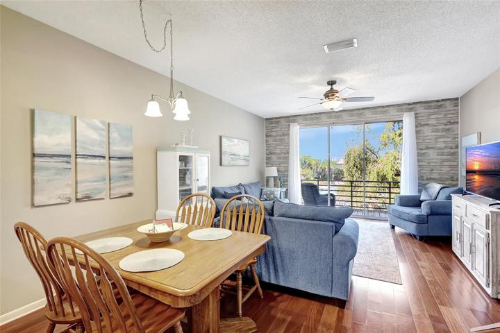 The dining room and living room come together in perfect harmony. This open and airy space is ideal for gatherings and daily living.