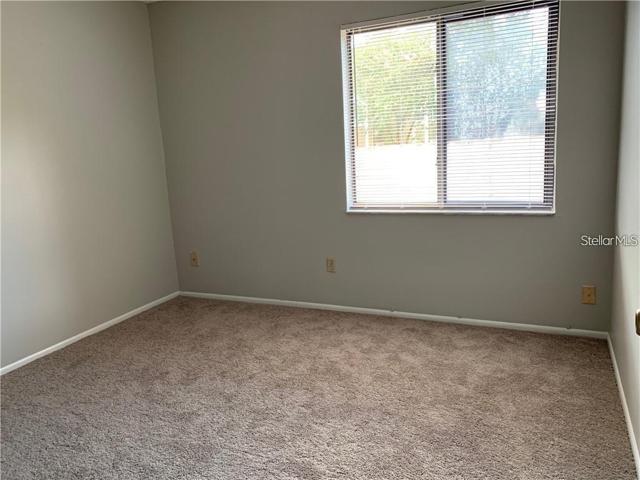 Two spacious bedrooms with large windows, closets and carpet.
