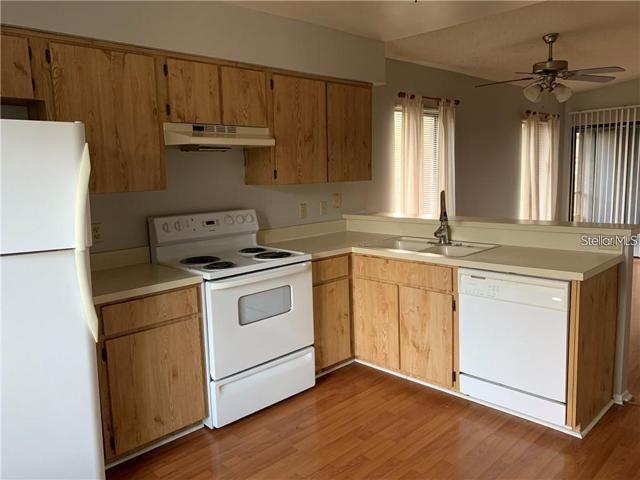 Kitchen has all updated stainless steel appliances. with plenty of cabinetry.