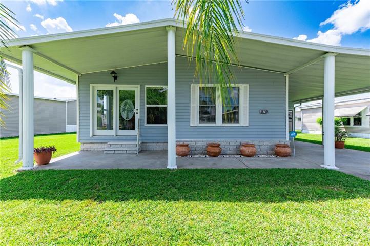 This home has a wonderful front covered patio for enjoying the Florida afternoon breeze.