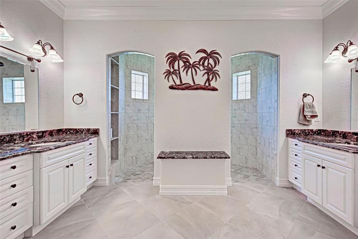 MASTER BATHROOM WITH LARGE WALK-IN SHOWER AND SEPARATE VANITIES