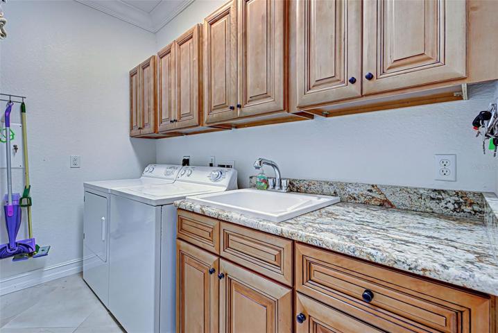 LAUNDRY ROOM WITH AMPLE STORAGE