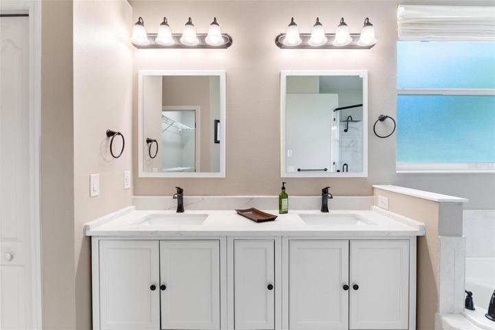 Master Bathroom with Dual Sinks and Vanities