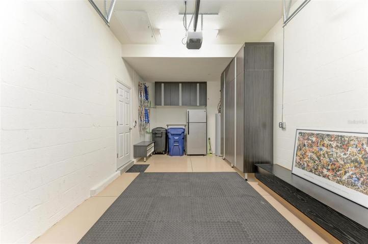 GARAGE WITH CUSTOM CABENTRY WITH SOFT CLOSE FEATURE