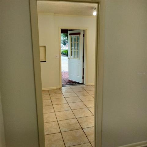 Looking from office into main room and front door