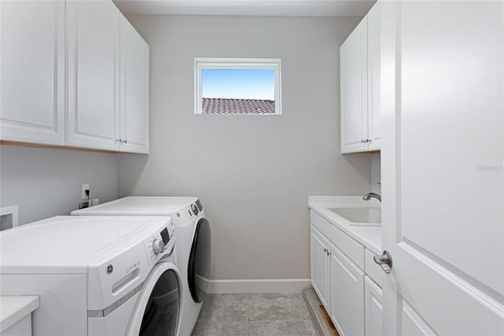 Laundry Room with sink and lots of cabinets