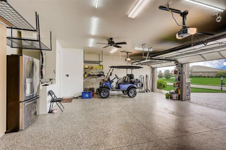 3 car fully air conditioned garage with epoxy floor