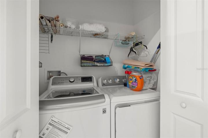 Laundry Closet with full size washer and dryer
