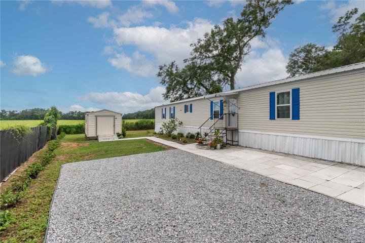 Gated Parking Area with Storage Shed