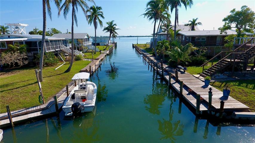 Your property boundary extends to the half-way mark in the canal.