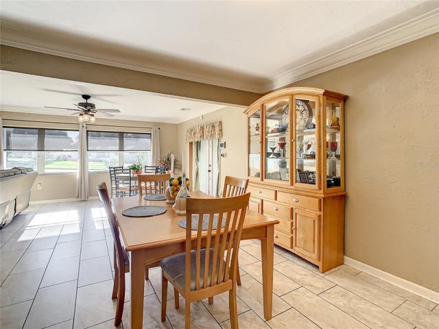 The dining room looking out the windows at the front of the home.