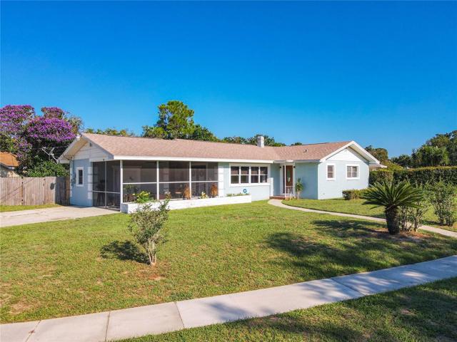 View of this corner lot home and the beautiful new shingle roof from February 2023.  Located in the city limits of Lake Wales, sidewalks provide easy options for walking in the community.
