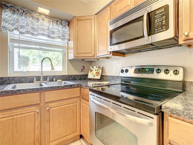 Enjoy a view of the back yard from the window over the kitchen sink.
