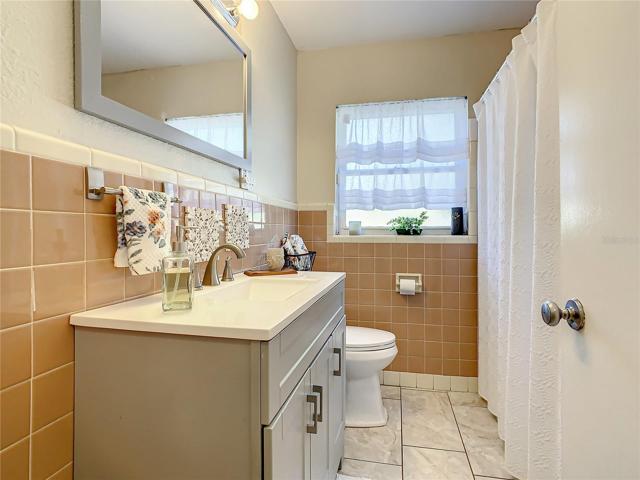 Guest bath has a tub/shower combination.