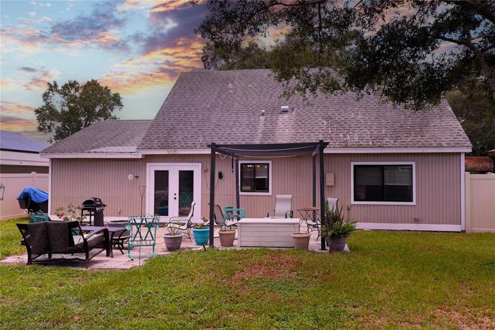 Large back yard with lots of seating options