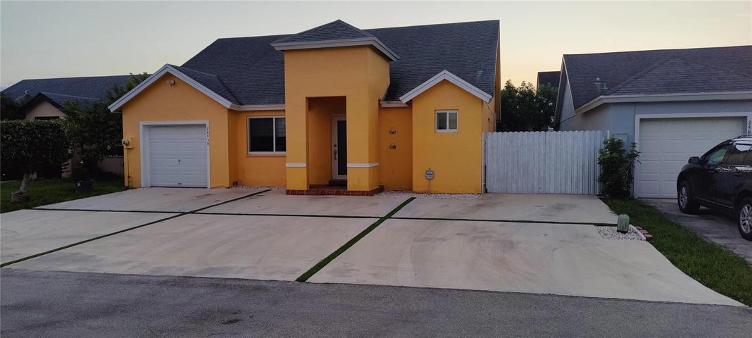 Front 45' X 30' parking pad in front of home with artificial grass boarder so no grass mowing!  60' long driveway along the right side of house.  Hurricane protected home has reinforced garage door, impact resistant double pane windows and removable metal hurricane shutters.