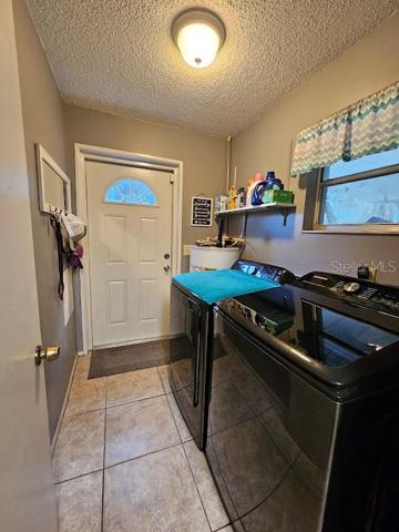 Inside Laundry Room with exterior door