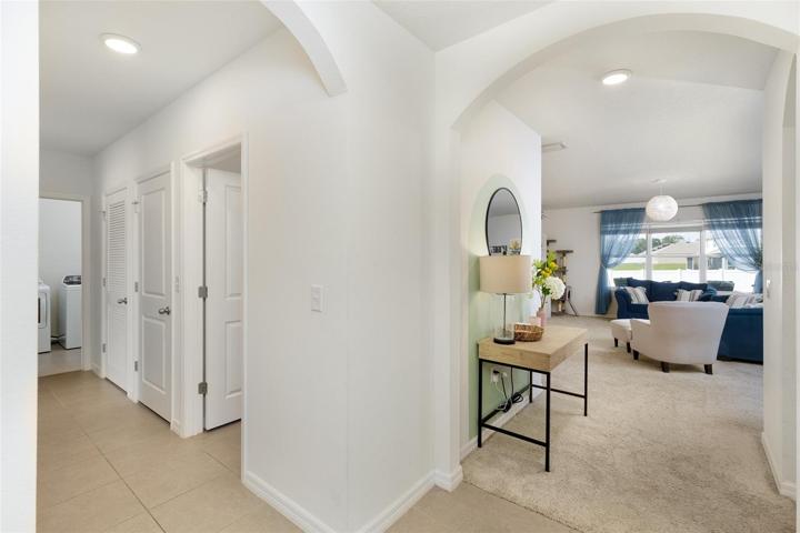 From foyer to living room and hallway to bedrooms 2 and 3 + bathroom 2