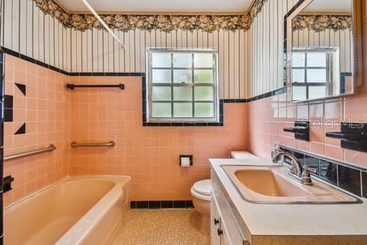 Secondary bath with tub and shower.