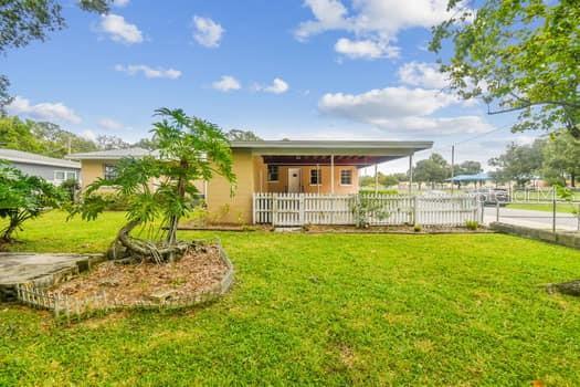Backyard with view of2 car carport.