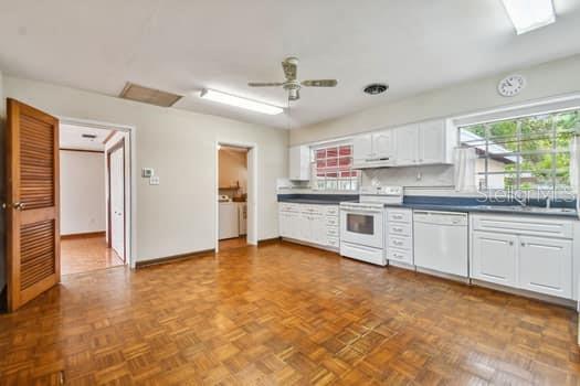 Kitchen opening to master bedroom and laundry room.