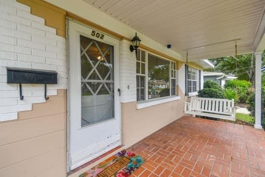 Sip your coffee or favorite beverage on the welcoming brick porch.