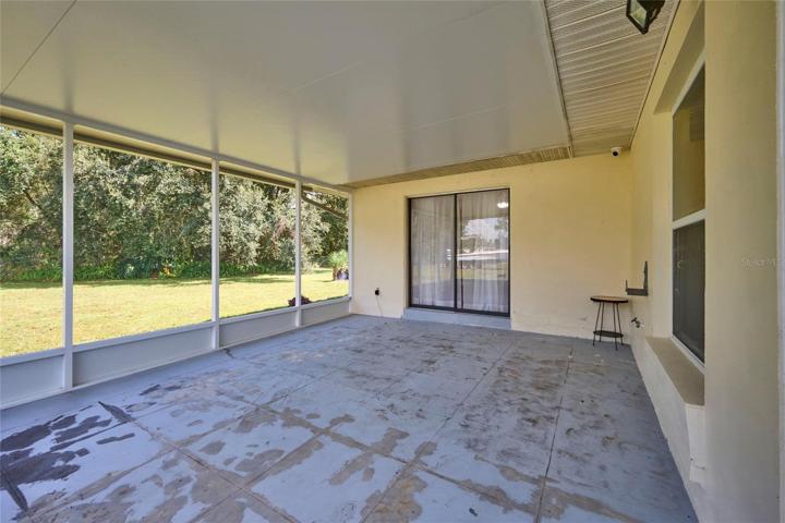 View of patio looking back to bonus room entrance.  Beautiful greenspace view!
