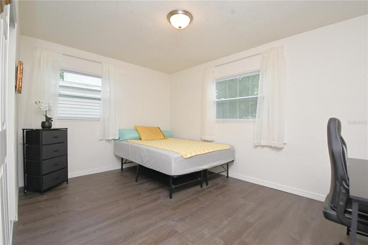 Bedroom #3 also features 2 windows and luxury vinyl flooring.