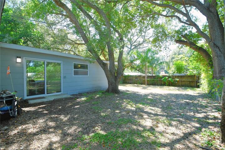 The back yard comes with an oak tree bringing in some shade.