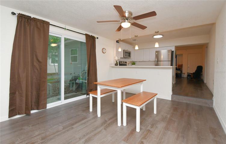 The breakfast bar with three pendant lights is the perfect spot to enjoy your morning coffee or gather with loved ones.