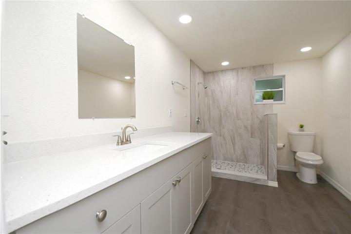 Pamper yourself in the upgraded bathroom, equipped with brand new vanity featuring quartz countertop.