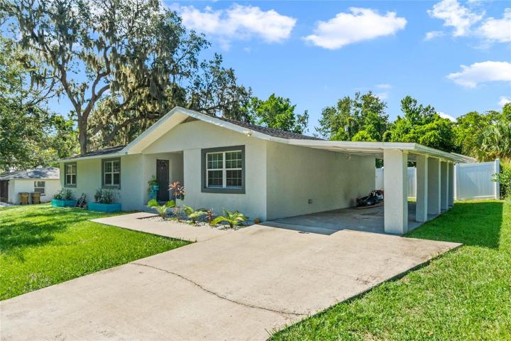 1 Car Carport w Long Driveway and Additional Gravel Parking Pad