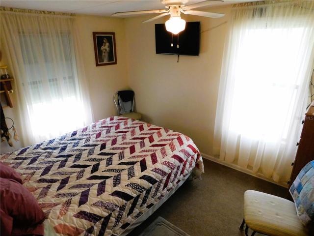 Master bedroom is located in back of the home.