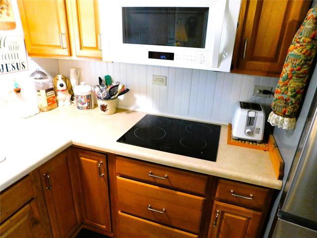 This kitchen offers wooden cabinets.