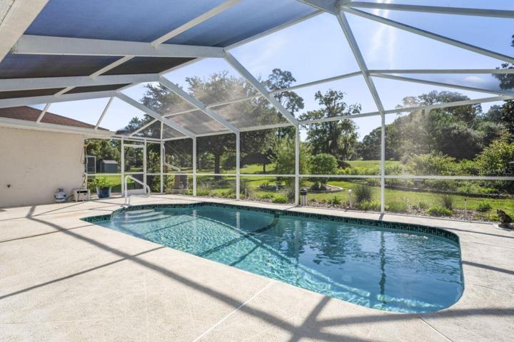View from Lanai to Pool and Backyard