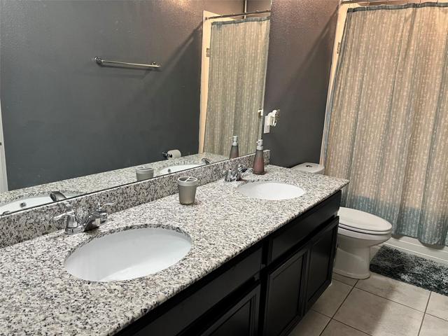 Upstairs bathroom Granite counter double sink.